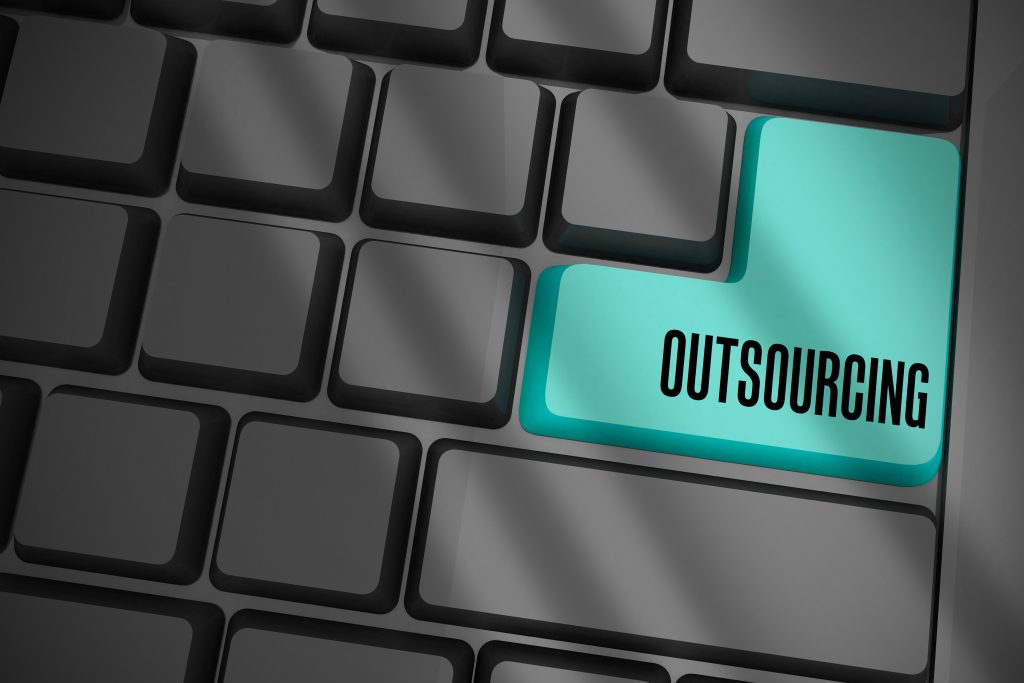 outsourcing on black keyboard